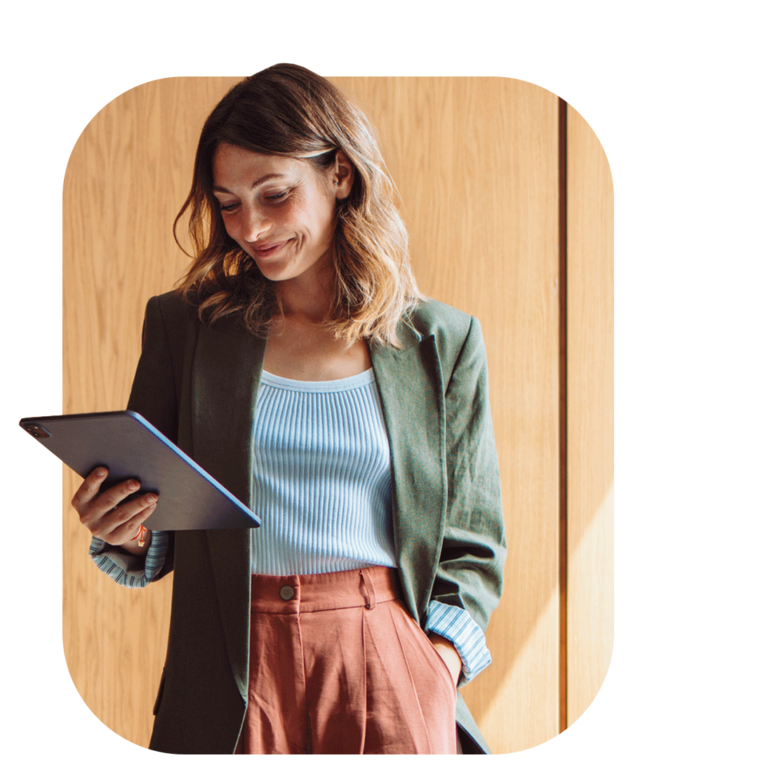 A woman with a tablet in hand, illustrating the integration of technology in contemporary workspaces for enhanced performance.