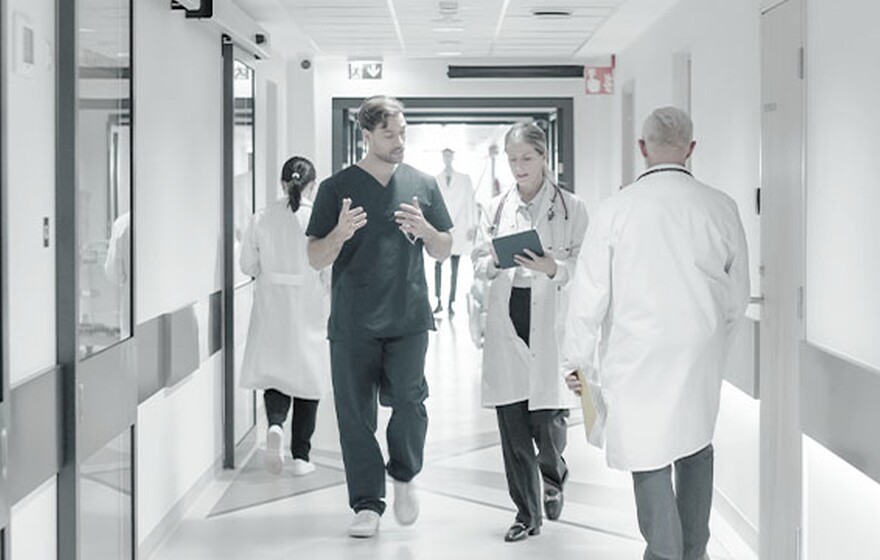 Medical staff walk through an Ahmedabad hospital enabled by Zyxel switches for fast data access and seamless operations