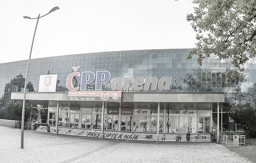 A panoramic photo of the CPP arena entrance in Czech, a large building with a blue glass facade and the name in red and white.
