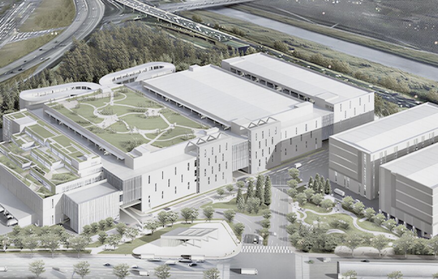 Zyxel Networks case study: Aerial view of a modern logistics complex with a large green rooftop park next to a highway.