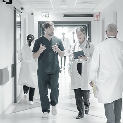 Medical staff walk through an Ahmedabad hospital enabled by Zyxel switches for fast data access and seamless operations