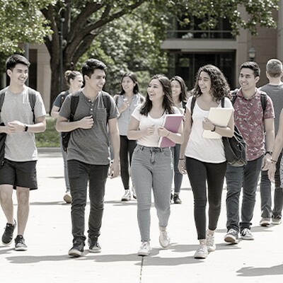 College students walk on sunny Indian campus, powered by Zyxel WAX610D, ATP800, switches, and Nebula for smart and secure WiFi.